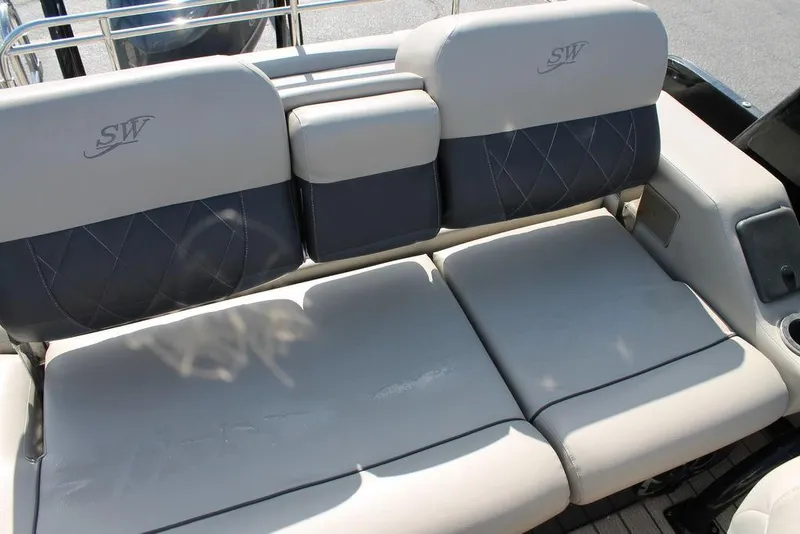 Slide: The Image of 2021 Silver Wave 2410 SW5 JS boat seating with gray upholstery and cup holder. - 11