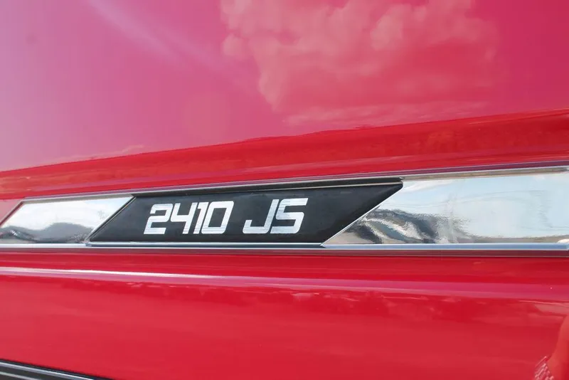 Slide: The Image of Close-up of 2021 Silver Wave 2410 SW5 JS model emblem on red surface. - 16