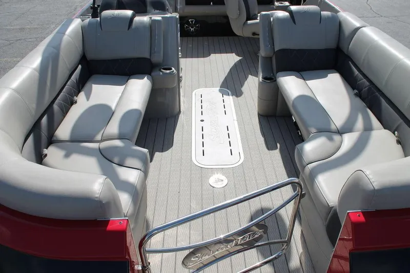 Slide: The Image of Interior of 2021 Silver Wave 2410 SW5 JS boat with gray seating and spacious layout. - 2