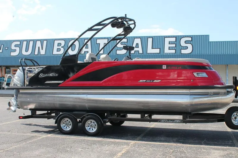 Slide: The Image of 2021 Silver Wave 2410 SW5 JS pontoon boat on trailer at dealership. - 5