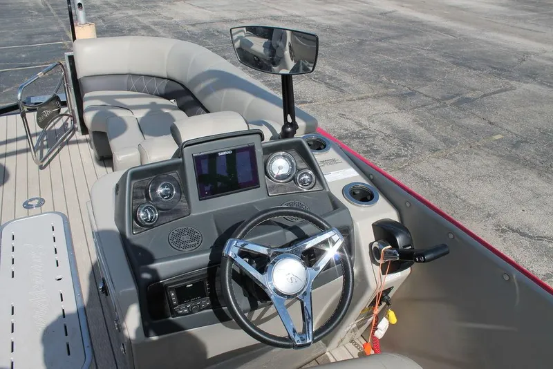 Slide: The Image of 2021 Silver Wave 2410 SW5 JS boat dashboard with steering wheel and navigation system. - 7