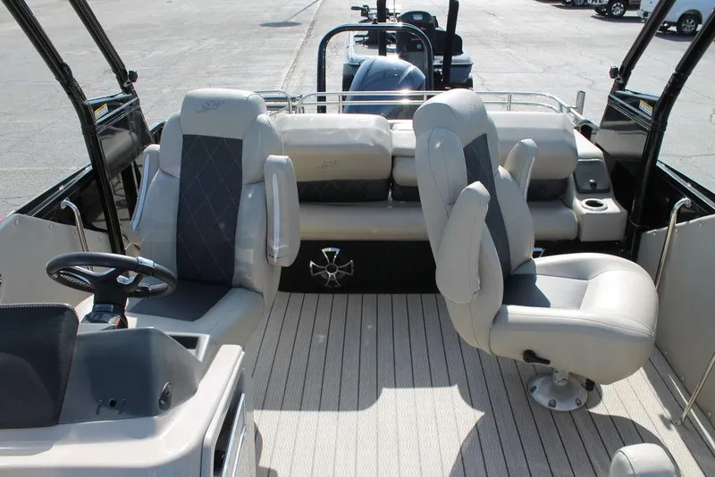 Slide: The Image of 2021 Silver Wave 2410 SW5 JS boat interior with plush seating and steering console. - 8