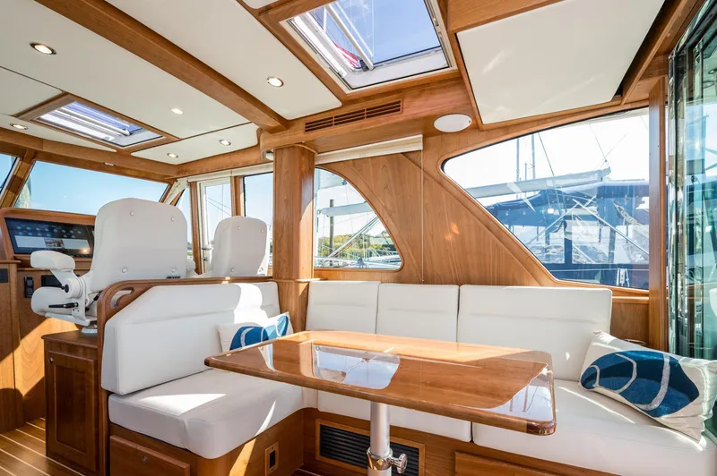 Slide: The Image of Luxurious interior of 2025 Sabre 43 Salon Express yacht with elegant wood and white seating. - 27