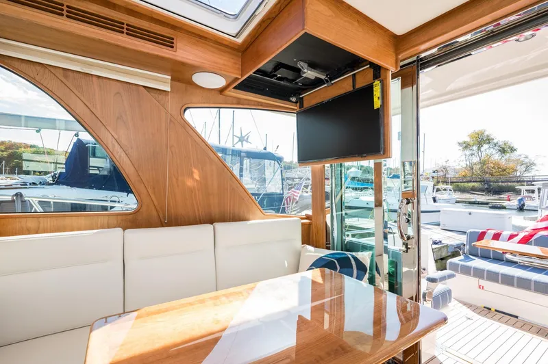 Slide: The Image of Luxurious interior of 2025 Sabre 43 Salon Express yacht with elegant wood finish and seating. - 28