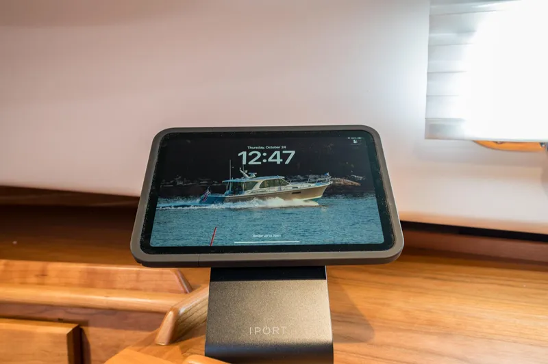 Slide: The Image of Tablet displaying time and boat image on Sabre 43 Salon Express, 2025 model. - 34