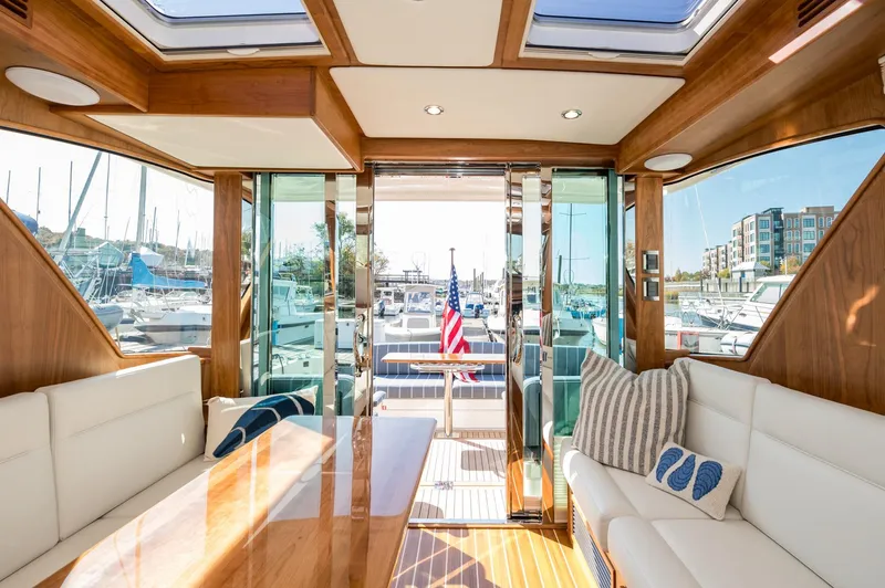 Slide: The Image of Luxurious interior of 2025 Sabre 43 Salon Express yacht with elegant wood finish and plush seating. - 40