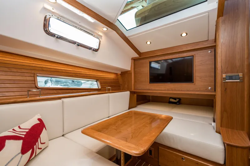 Slide: The Image of Luxurious interior of 2025 Sabre 43 Salon Express yacht with wood finish and plush seating. - 41