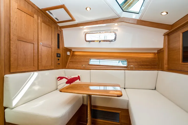 Slide: The Image of Luxurious interior of 2025 Sabre 43 Salon Express yacht with elegant wood finish and plush seating. - 42