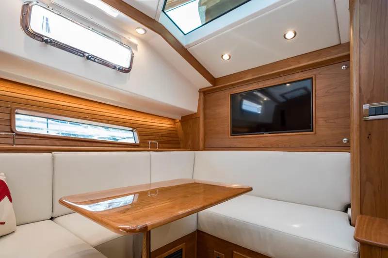 Slide: The Image of Luxurious interior of 2025 Sabre 43 Salon Express yacht with wood accents and seating. - 43