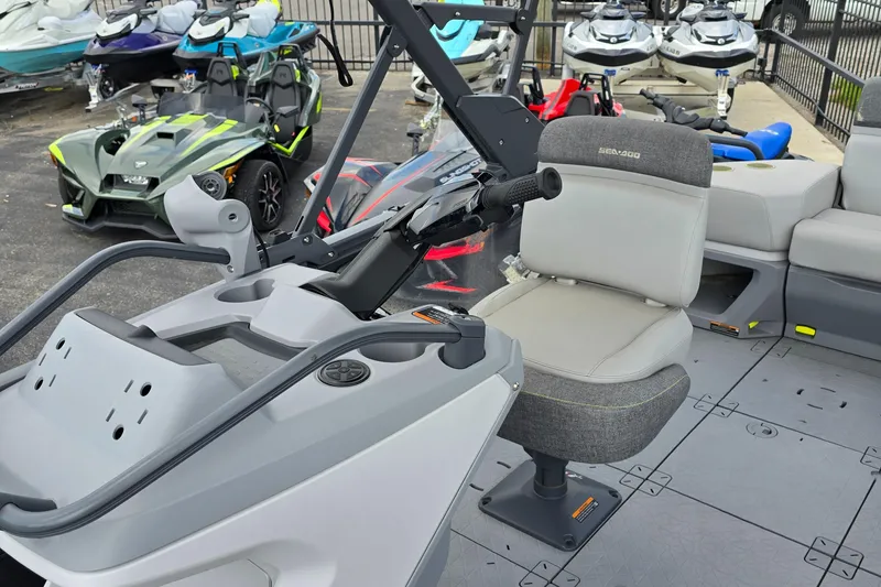 Slide: The Image of 2023 Sea-Doo Switch Sport 21 interior with steering and seating, surrounded by other vehicles. - 7