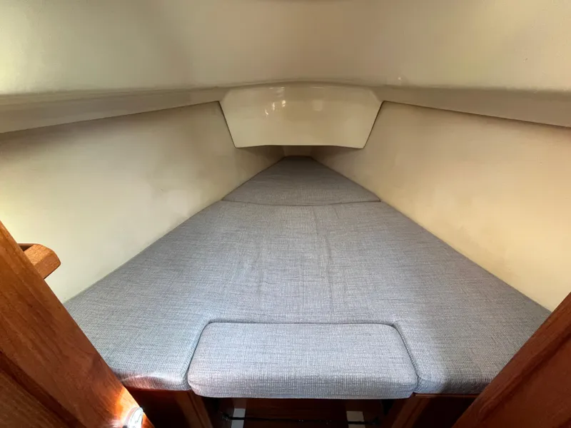 Slide: The Image of Interior cabin of 1992 Hunter 30-2 sailboat with a cozy sleeping berth. - 16