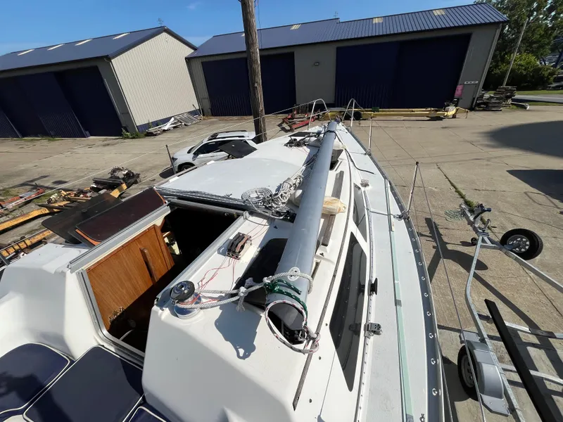 Slide: The Image of Sailboat Hunter 30-2, 1992 model, docked near storage buildings. - 25