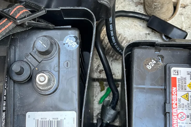 Slide: The Image of Battery compartment of a 1992 Hunter 30-2 sailboat with visible wiring and labels. - 33