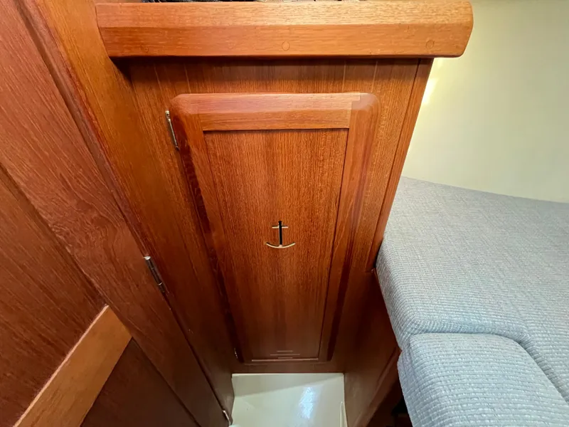 Slide: The Image of Wooden cabinet door inside a 1992 Hunter 30-2 sailboat interior. - 17