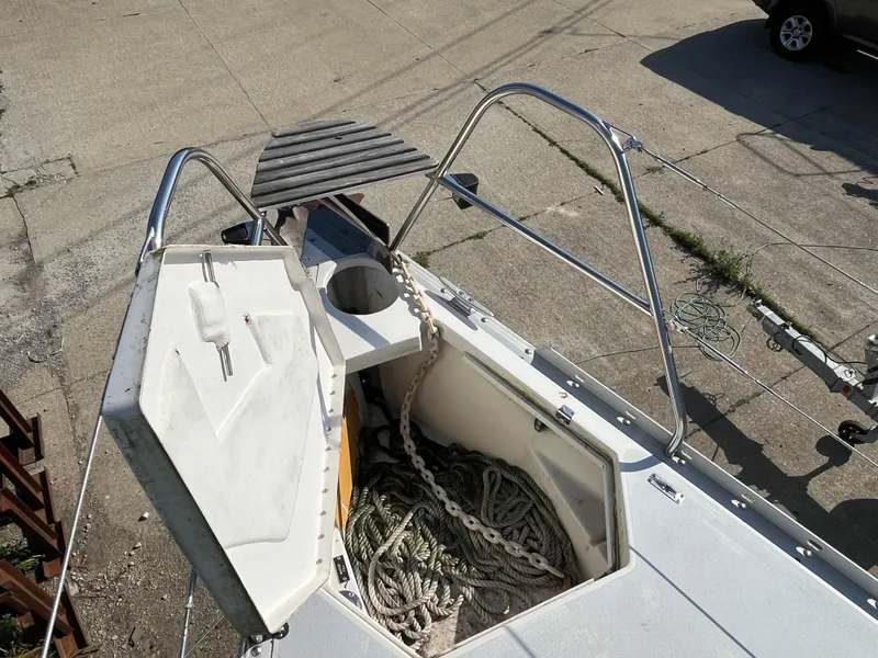 Slide: The Image of Open anchor locker on 1992 Hunter 30-2 sailboat, showing ropes and chains. - 23