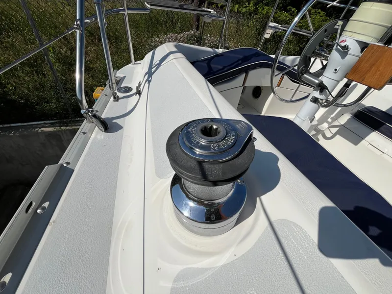Slide: The Image of Deck of 1992 Hunter 30-2 sailboat featuring a winch and steering wheel. - 26