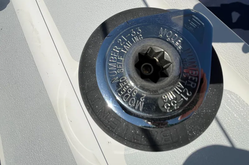 Slide: The Image of Close-up of a 1992 Hunter 30-2 boat winch, model number 21-33, in sunlight. - 28