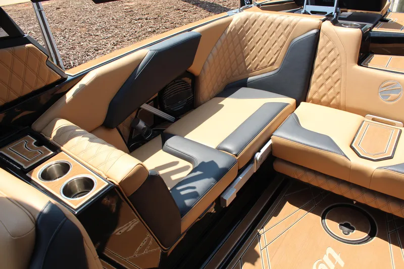 Slide: The Image of Luxurious interior of 2024 Tigé 24RZX boat with tan and black seating. - 10