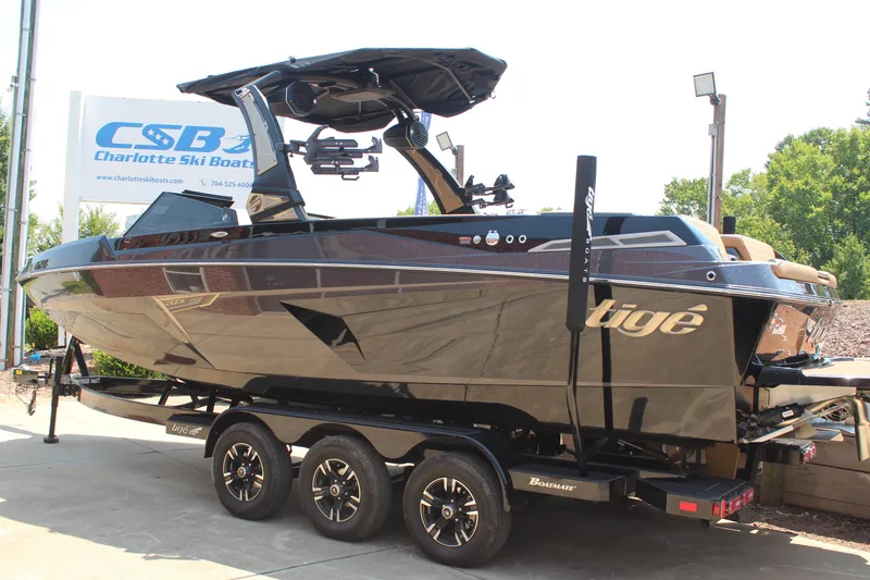 Slide: The Image of 2024 Tigé 24RZX boat on trailer at Charlotte Ski Boats dealership. - 3