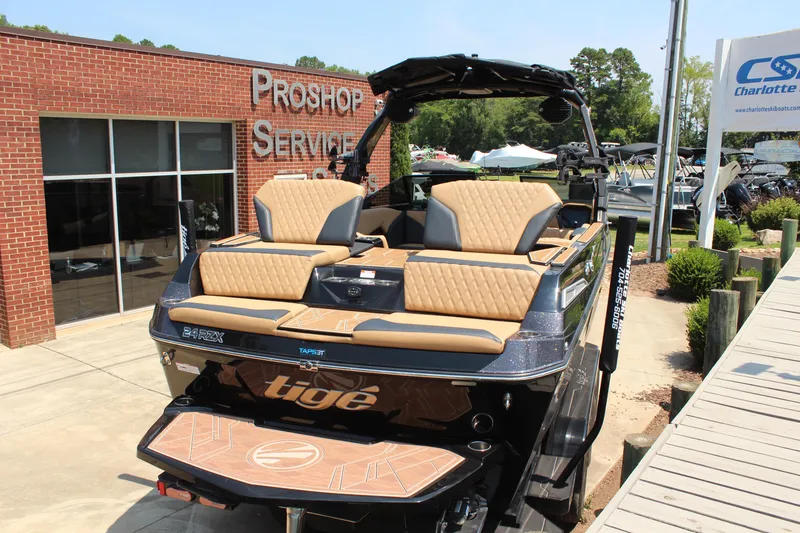 Slide: The Image of 2024 Tigé 24RZX boat at a pro shop, showcasing luxury seating and sleek design. - 4