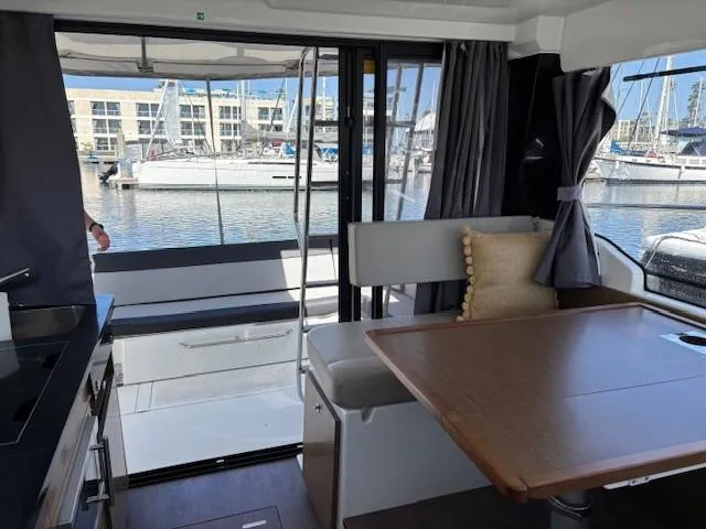 Slide: The Image of Interior of 2020 Jeanneau NC 1095 Fly yacht with marina view. - 14
