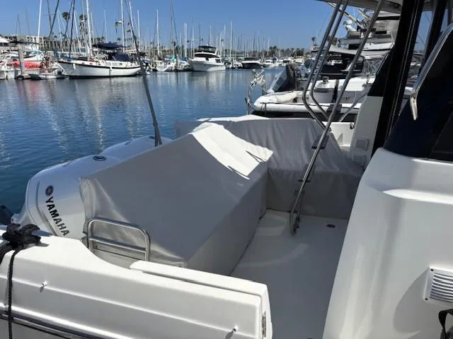 Slide: The Image of 2020 Jeanneau NC 1095 Fly yacht docked in marina, featuring Yamaha engine. - 24