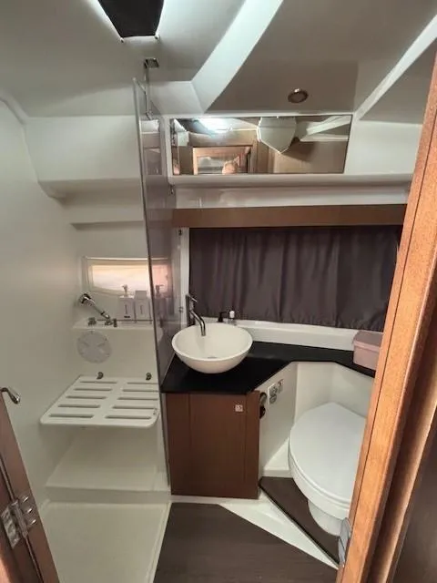 Slide: The Image of 2020 Jeanneau NC 1095 Fly bathroom with modern fixtures and compact design. - 25