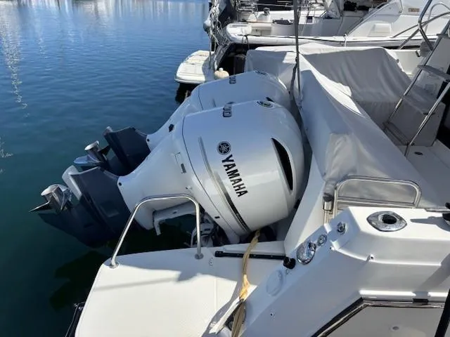 Slide: The Image of 2020 Jeanneau NC 1095 Fly with Yamaha outboard engines docked at marina. - 32