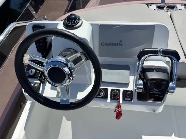 Slide: The Image of Helm of 2020 Jeanneau NC 1095 Fly with Garmin navigation and Yamaha controls. - 36