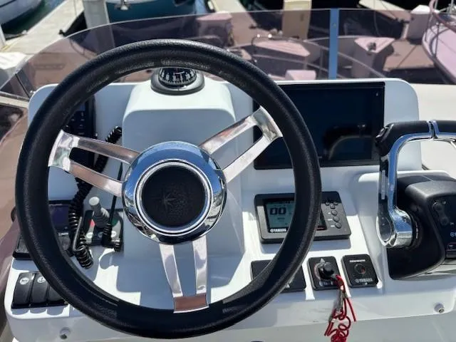 Slide: The Image of Steering wheel and controls of 2020 Jeanneau NC 1095 Fly boat. - 38