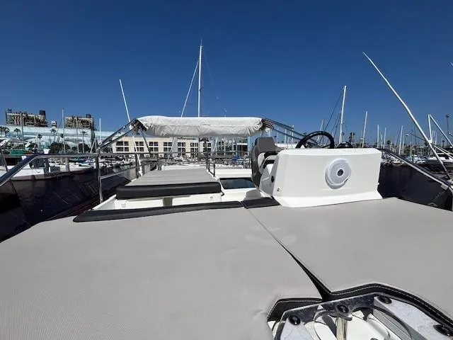 Slide: The Image of Flybridge view of 2020 Jeanneau NC 1095 Fly yacht in marina setting. - 40
