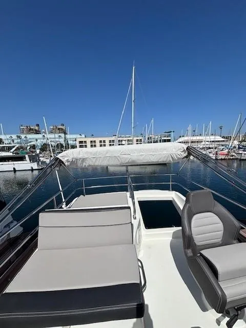 Slide: The Image of Flybridge view of 2020 Jeanneau NC 1095 Fly yacht in marina setting. - 44