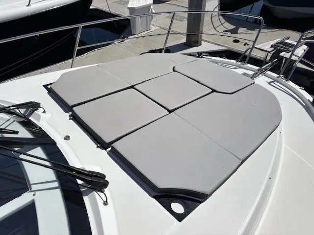 Slide: The Image of Sunbathing deck on 2020 Jeanneau NC 1095 Fly boat, docked at marina. - 5