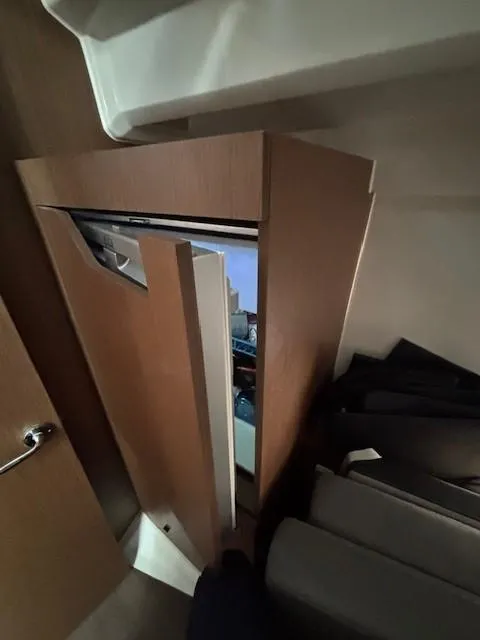 Slide: The Image of Wooden cabinet interior on Jeanneau NC 1095 Fly 2020 boat. - 9