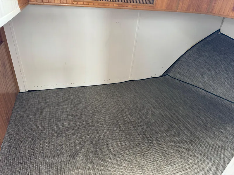 Slide: The Image of Interior cabin of 1993 Gibson 37 Sport Series boat with carpeted flooring. - 15