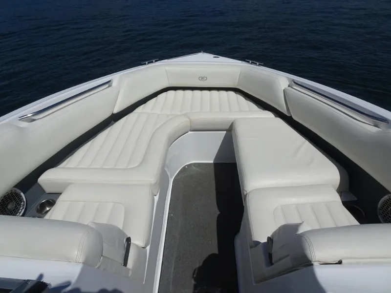 Slide: The Image of 2016 Cobalt R7 boat with luxurious white seating on calm water. - 15