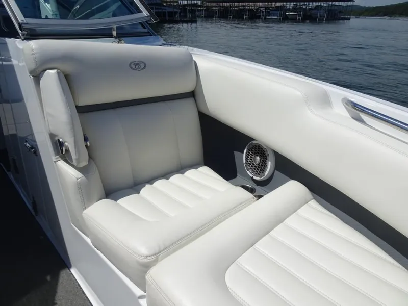 Slide: The Image of Luxurious white seating on a 2016 Cobalt R7 boat, with lake view in background. - 17
