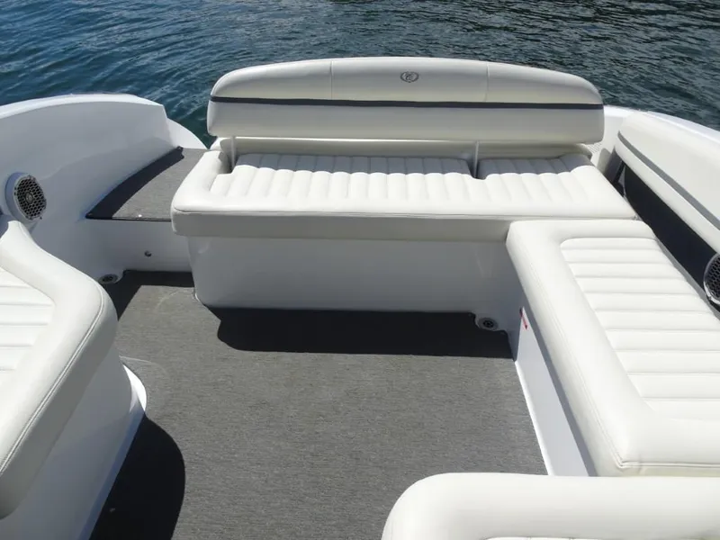 Slide: The Image of 2016 Cobalt R7 boat interior with white cushioned seating and gray flooring. - 19