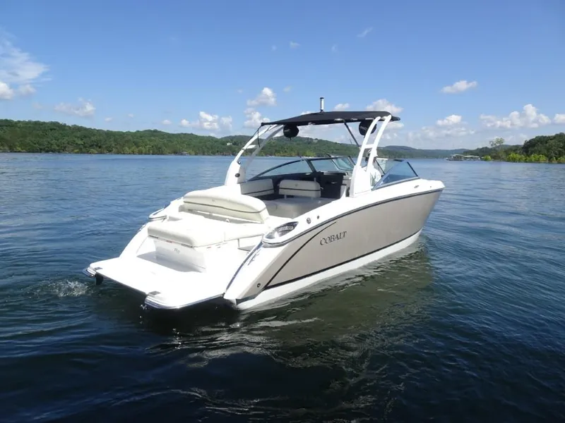 Slide: The Image of 2016 Cobalt R7 boat on a serene lake with clear skies. - 2