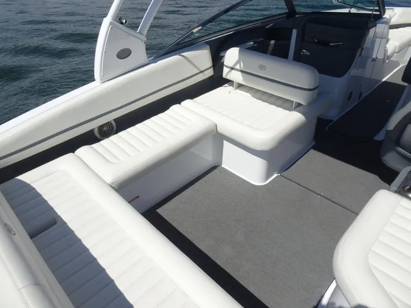 Slide: The Image of 2016 Cobalt R7 boat interior with white seating and gray carpet. - 7
