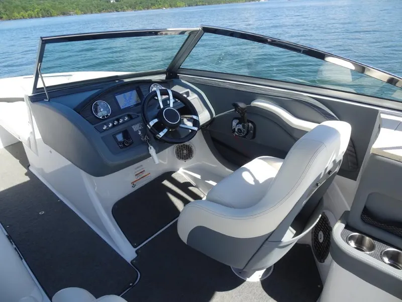 Slide: The Image of 2016 Cobalt R7 boat interior with steering wheel and dashboard on a sunny day. - 9