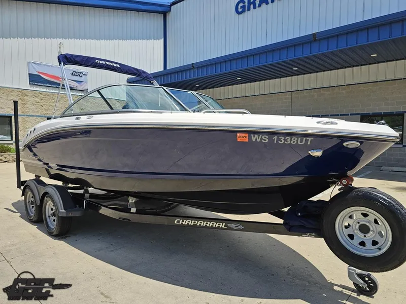 Slide: The Image of 2020 Chaparral 21 SSi boat on trailer outside dealership. - 14