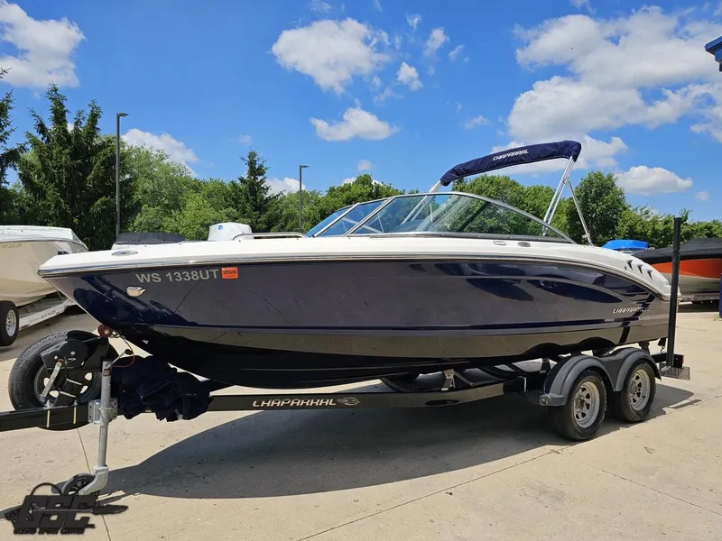 Slide: The Image of 2020 Chaparral 21 SSi boat on trailer under blue sky. - 20