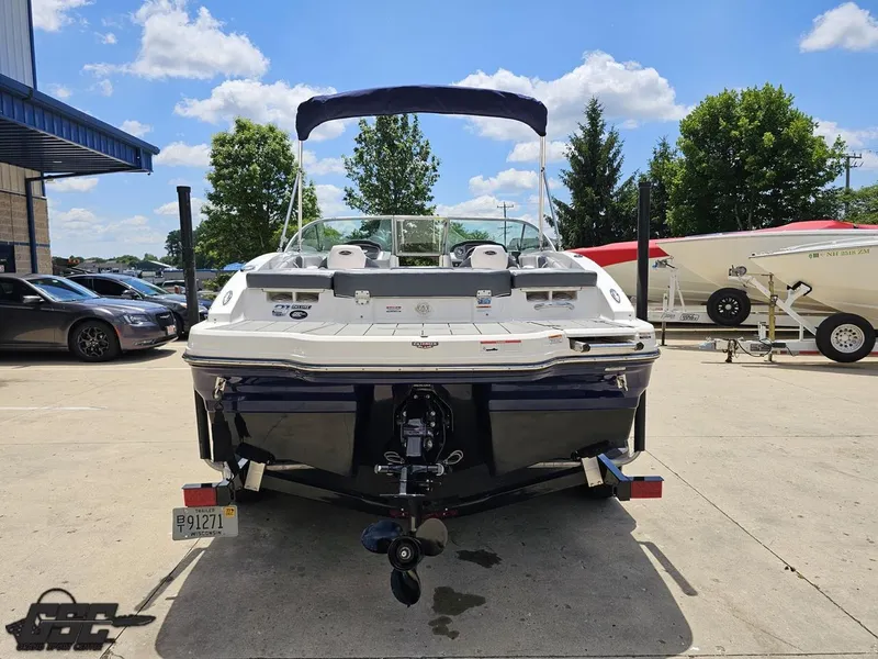 Slide: The Image of 2020 Chaparral 21 SSi boat parked outdoors on a sunny day. - 36