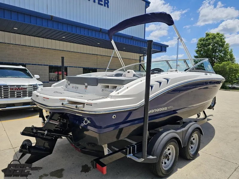 Slide: The Image of 2020 Chaparral 21 SSi boat on trailer, parked outside dealership. - 39