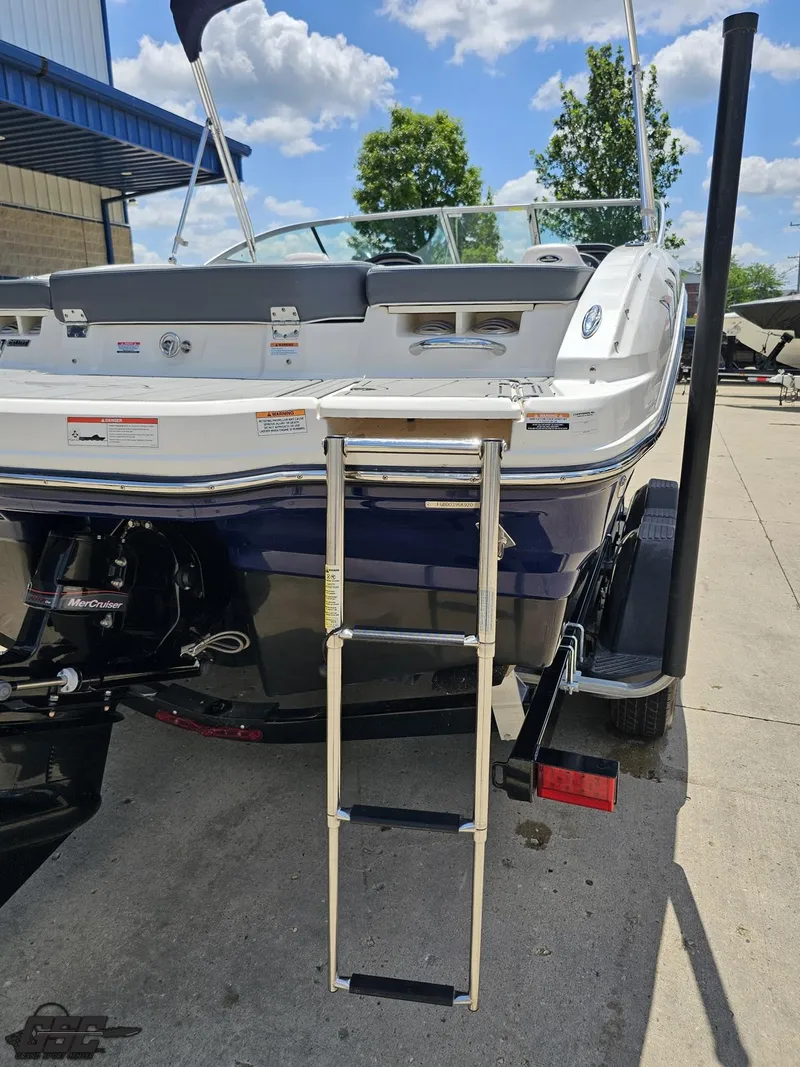 Slide: The Image of 2020 Chaparral 21 SSi boat with ladder, parked outdoors on a sunny day. - 42