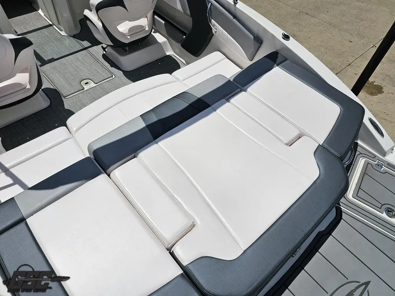 Slide: The Image of 2020 Chaparral 21 SSi boat interior with white and gray seating. - 45