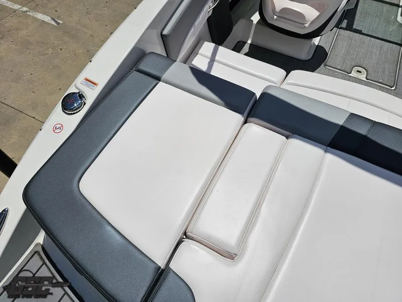 Slide: The Image of 2020 Chaparral 21 SSi boat interior with cushioned seating and sleek design. - 48