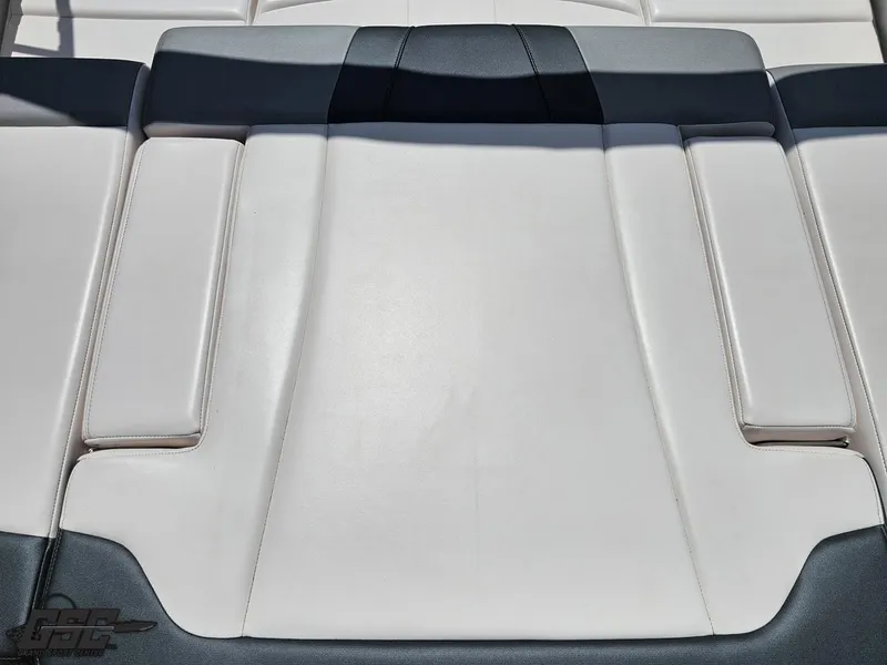 Slide: The Image of 2020 Chaparral 21 SSi boat seat upholstery, featuring sleek white and black design. - 49