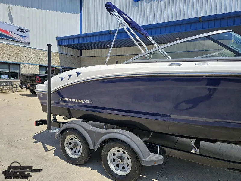 Slide: The Image of 2020 Chaparral 21 SSi boat on trailer outside a building. - 6